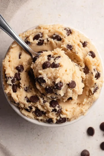 Cottage Cheese Cookie Dough Protein dessert with a scoop on a wooden table