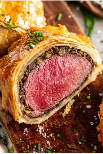 Homemade Beef Wellington ready to serve, showcasing flaky pastry and tender beef.