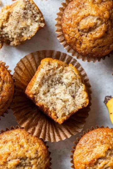 Freshly baked banana muffins cooling on a wire rack
