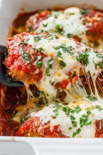 Delicious Chicken Parmesan topped with marinara sauce and melted cheese