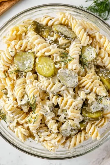 Delicious Dill Pickle Pasta Salad served in a bowl with vibrant ingredients.