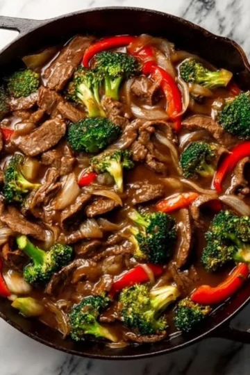 Delicious easy beef stir fry served with colorful vegetables