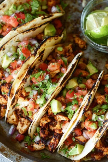 Delicious easy chicken tacos served on a plate with fresh toppings