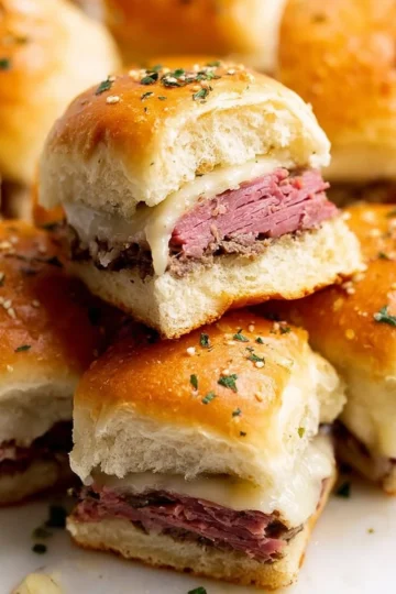 Delicious easy roast beef sliders served on a platter with toppings