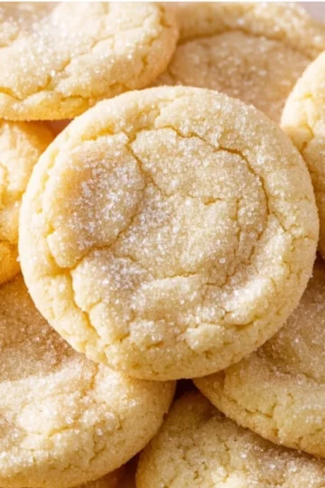 Easy sugar cookie recipe with baked cookies on a cooling rack.