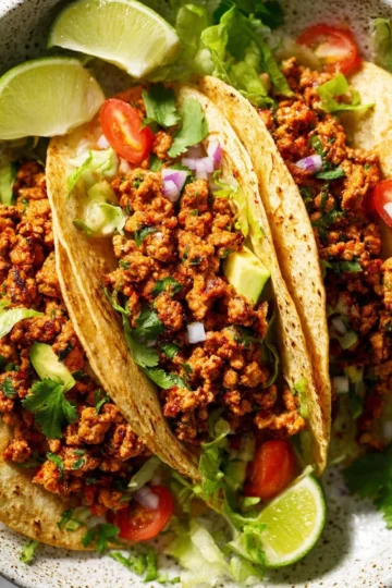 Delicious ground beef tacos served with toppings and fresh ingredients