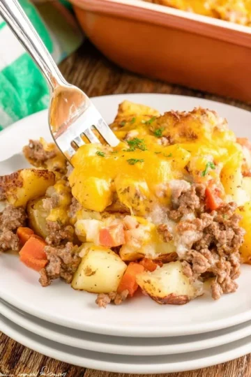Baked Hobo Casserole with vegetables and ground meat in a rustic dish