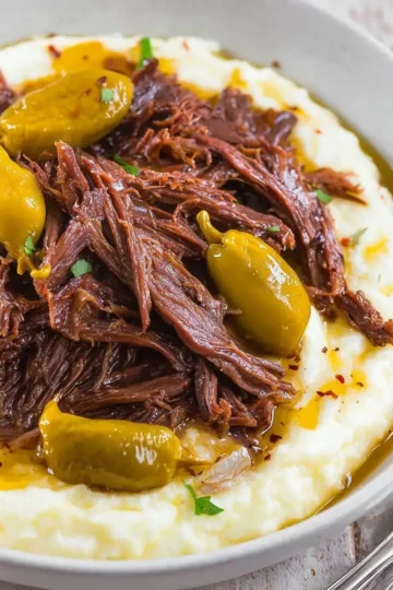 Delicious Mississippi Pot Roast served with vegetables and gravy