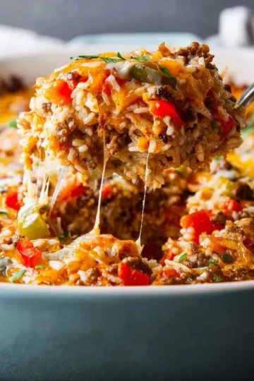 Delicious stuffed pepper casserole with colorful bell peppers and savory ingredients.