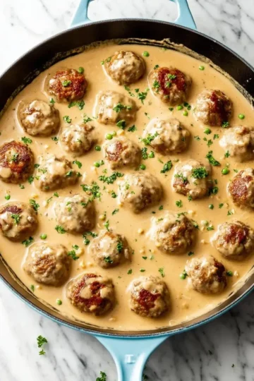Delicious plate of Swedish Meatballs served with gravy and lingonberry sauce